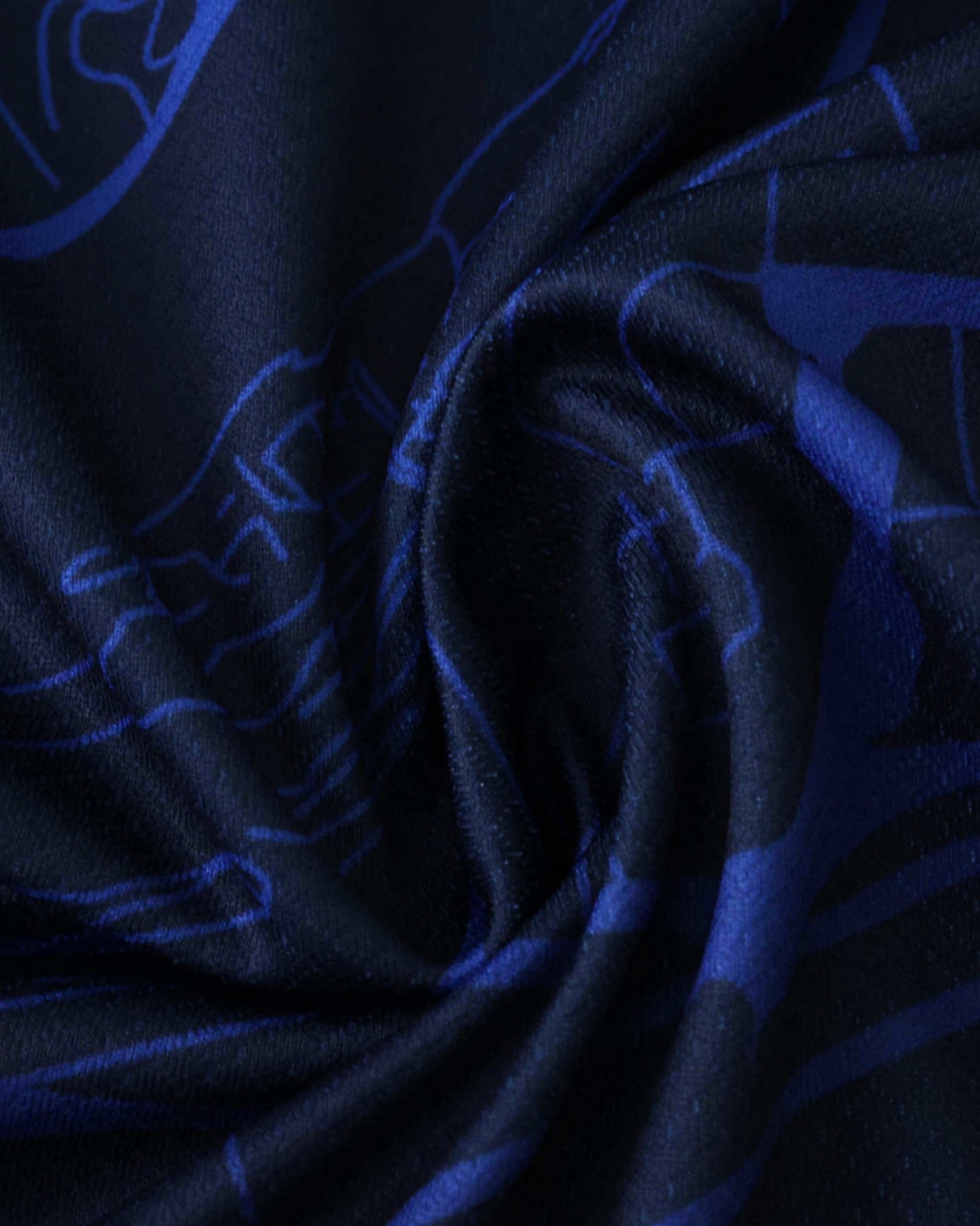 Close-up of the navy blue Paris map fabric on the PSG x The Parisians premium football jersey