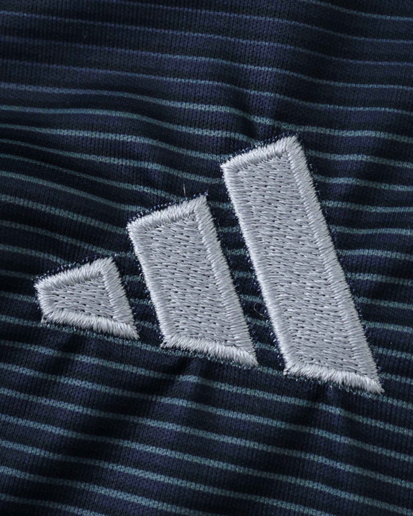 Real Madrid away kids football jersey 2025/26 close-up of navy pinstripe fabric with Adidas logo