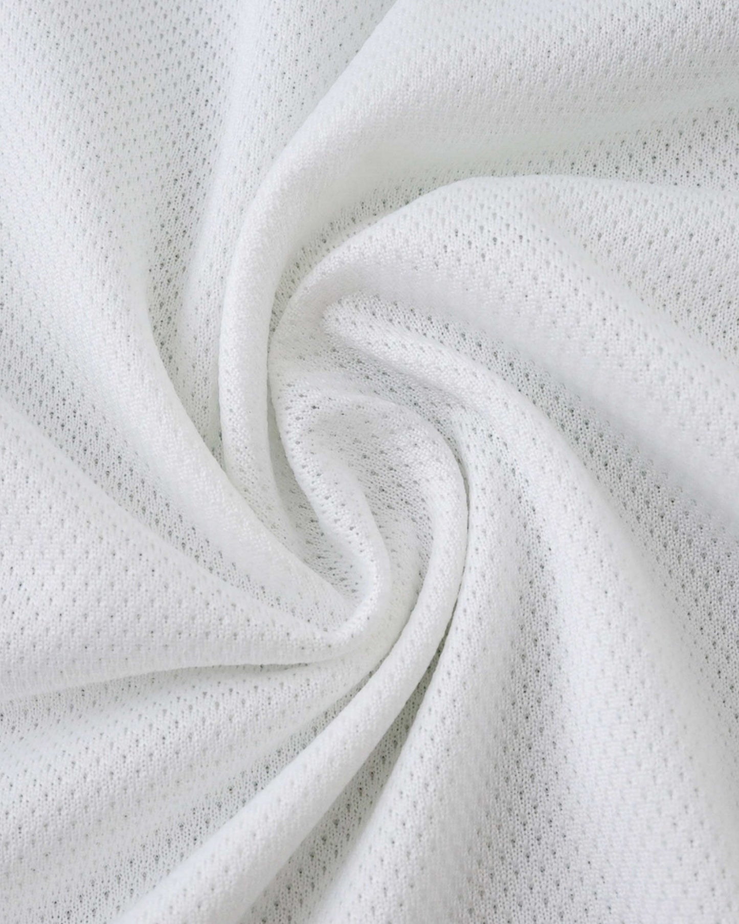 Real Madrid home football jersey 2025/26 white fabric close-up showing mesh texture