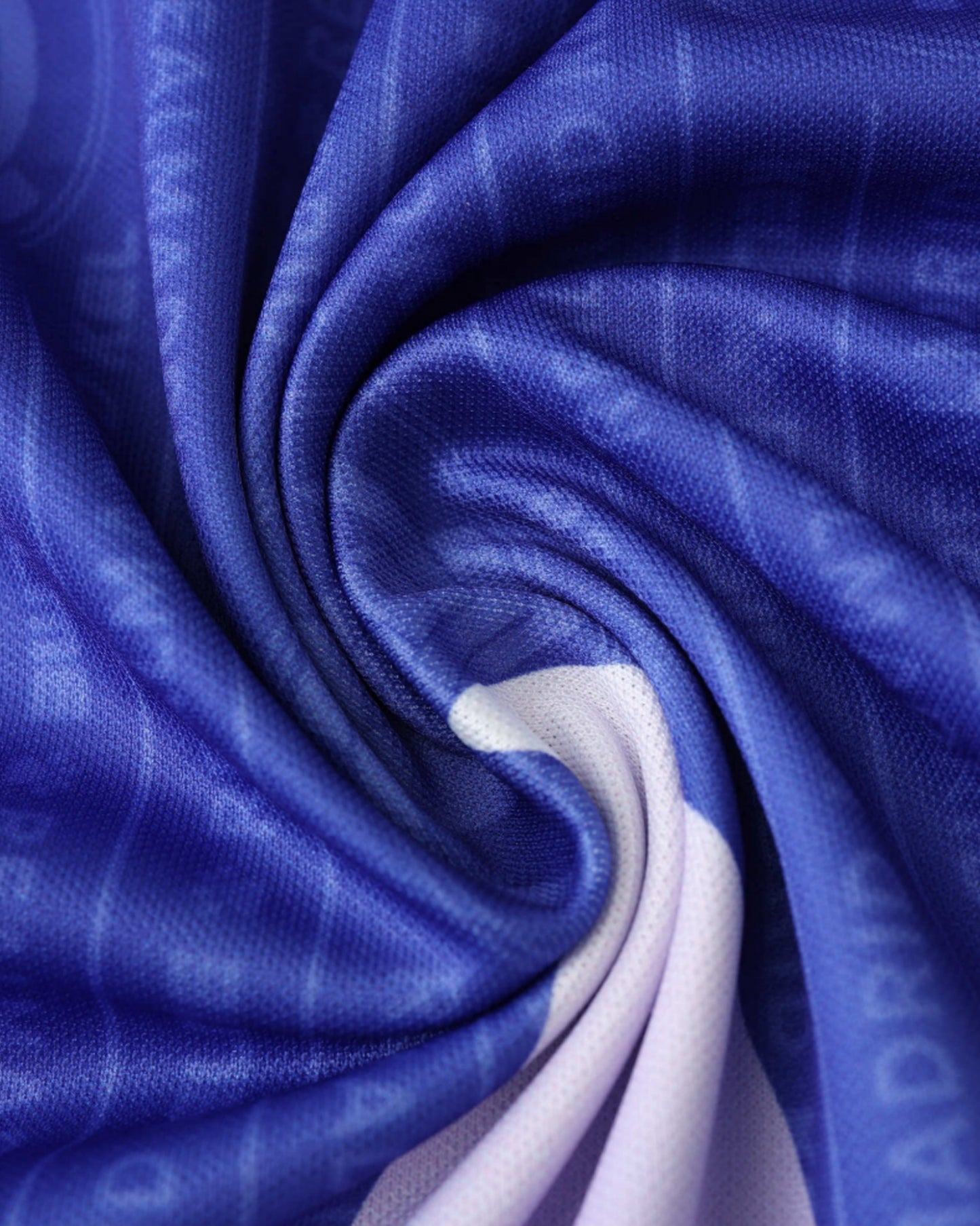 Real Madrid 1996/97 retro away football jersey close-up of purple fabric texture