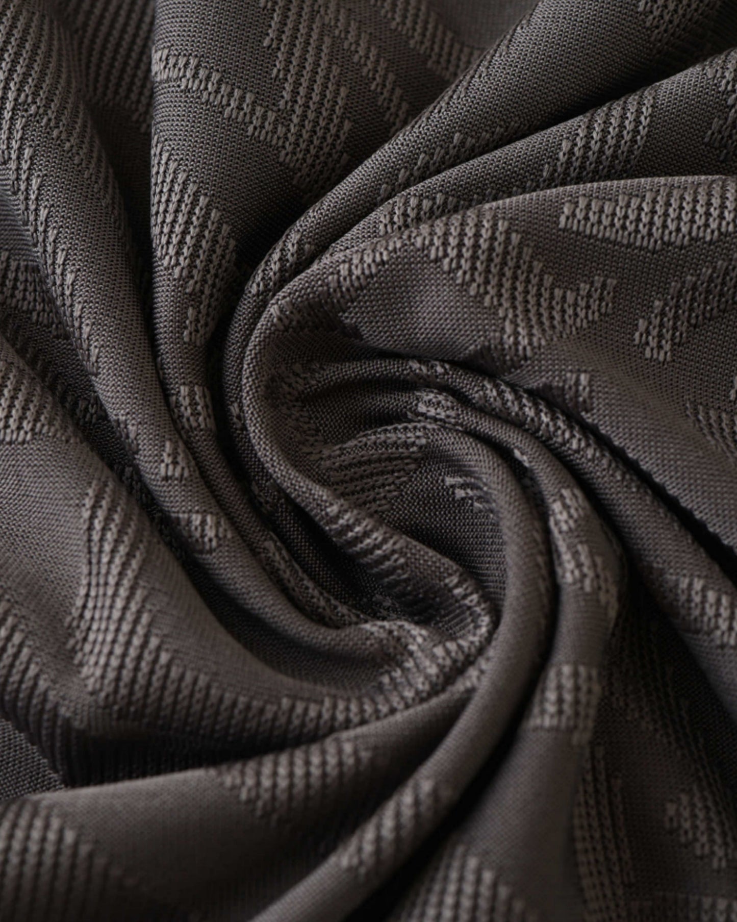 Close-up of grey Real Madrid third football jersey 2024/25 monogram fabric