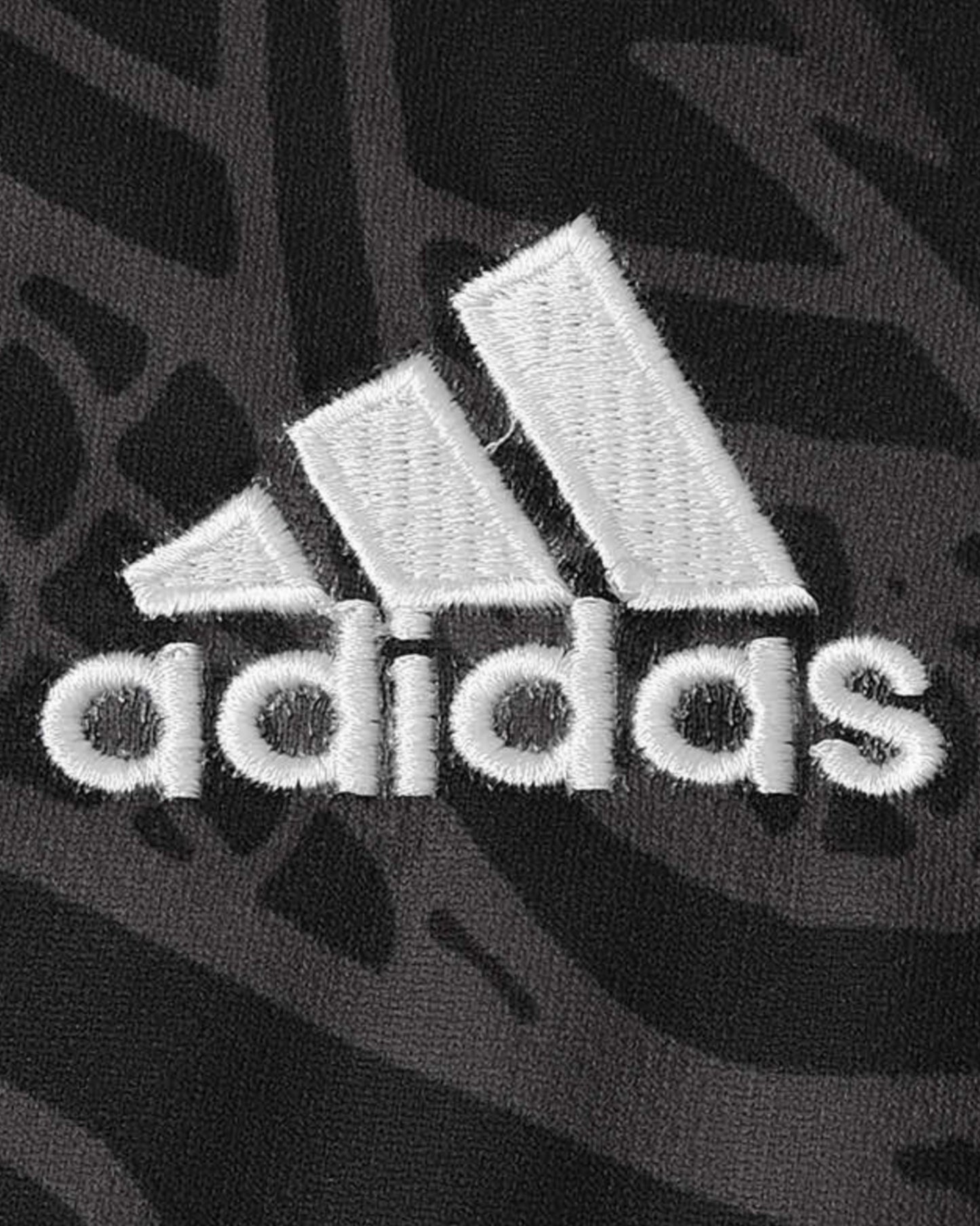 Real Madrid Dragon Negro football jersey white Adidas logo on black dragon-print fabric
