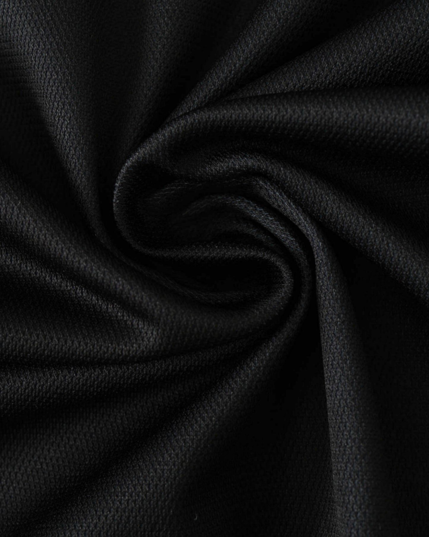 Real Madrid x Y-3 black football jersey fabric close-up showing textured weave