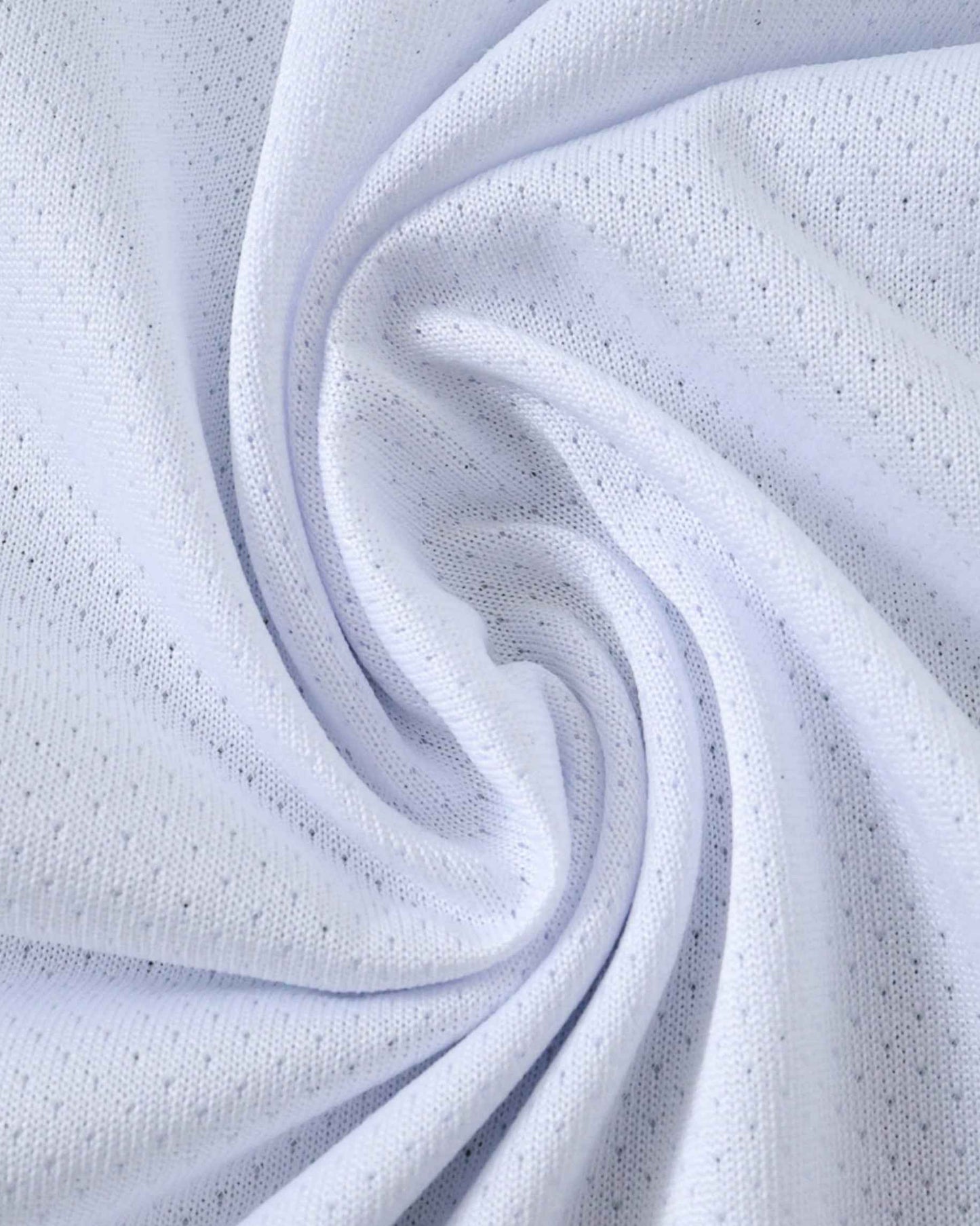 White textured fabric with small perforations, draped in a swirl.