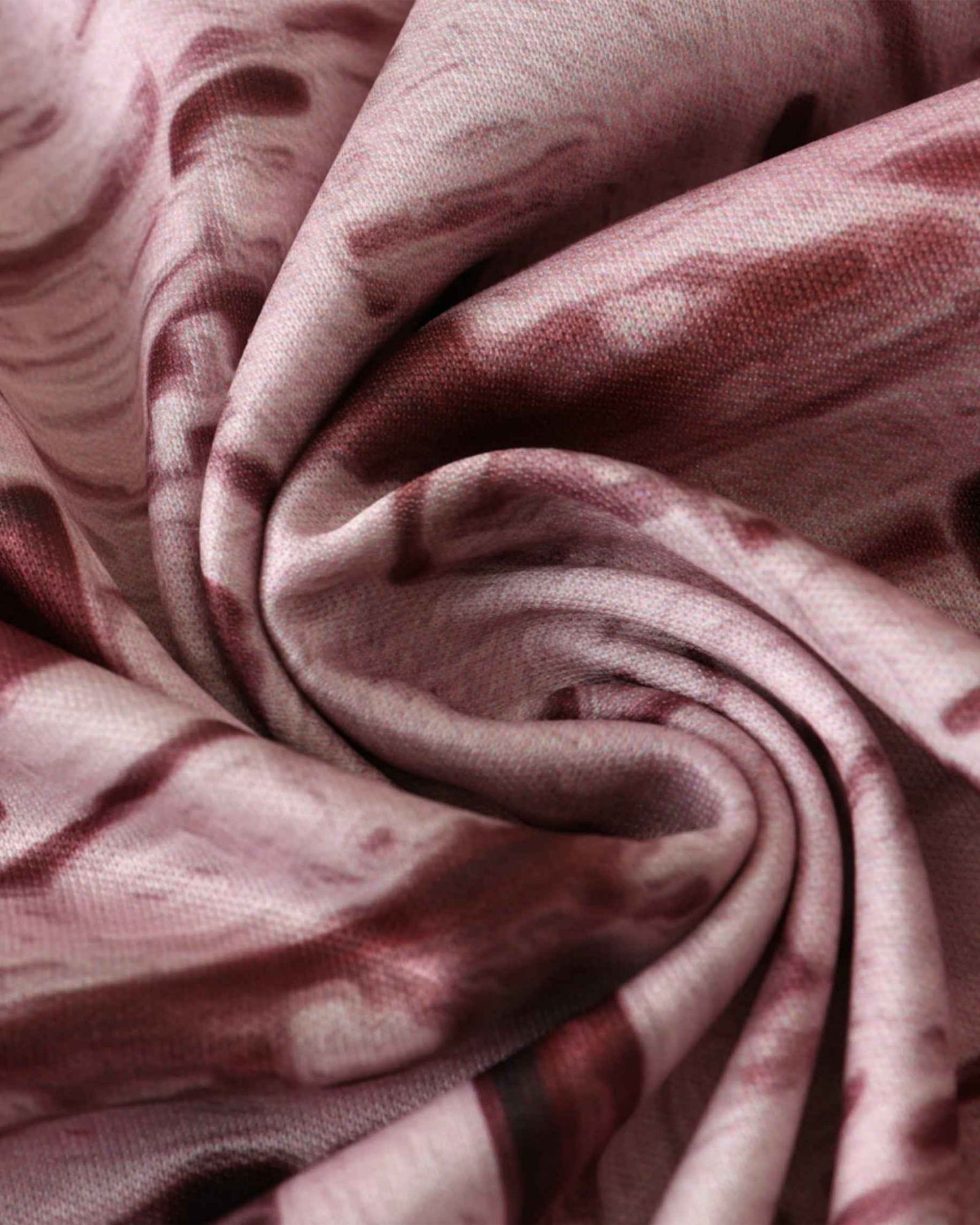 Pink and maroon marbled fabric detail of the Spain x Palacio de Cibeles football jersey 2024