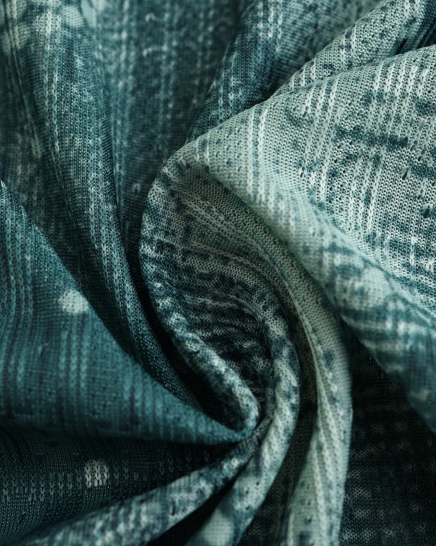 Close-up of the teal watercolour camo fabric on the Tottenham Hotspur third football jersey 2024/25