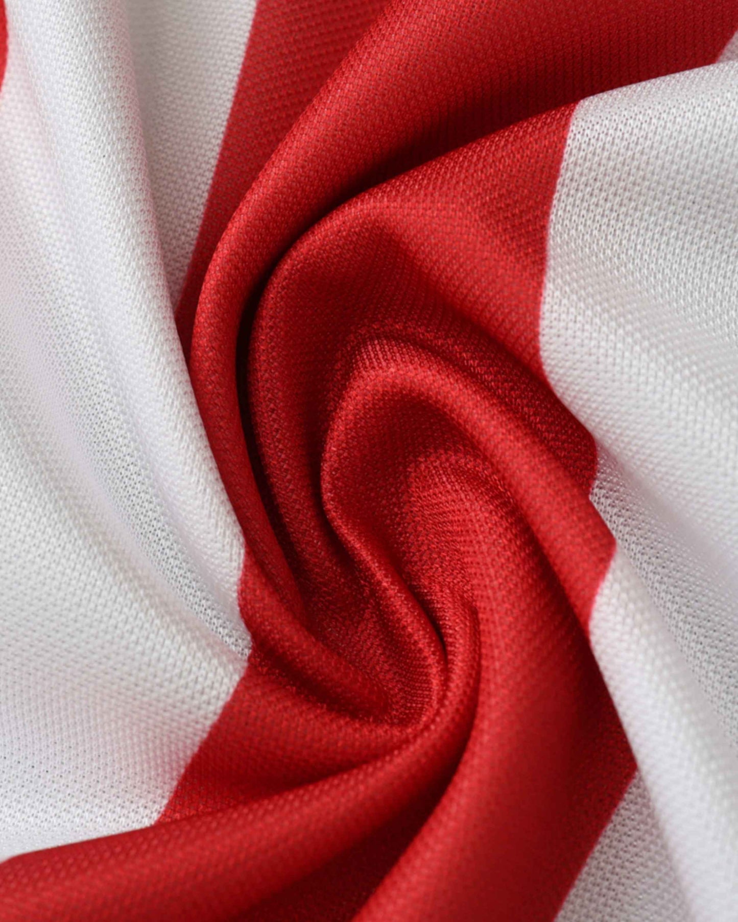 Close-up of red and white wavy stripe fabric on USA retro home football jersey 1994/95
