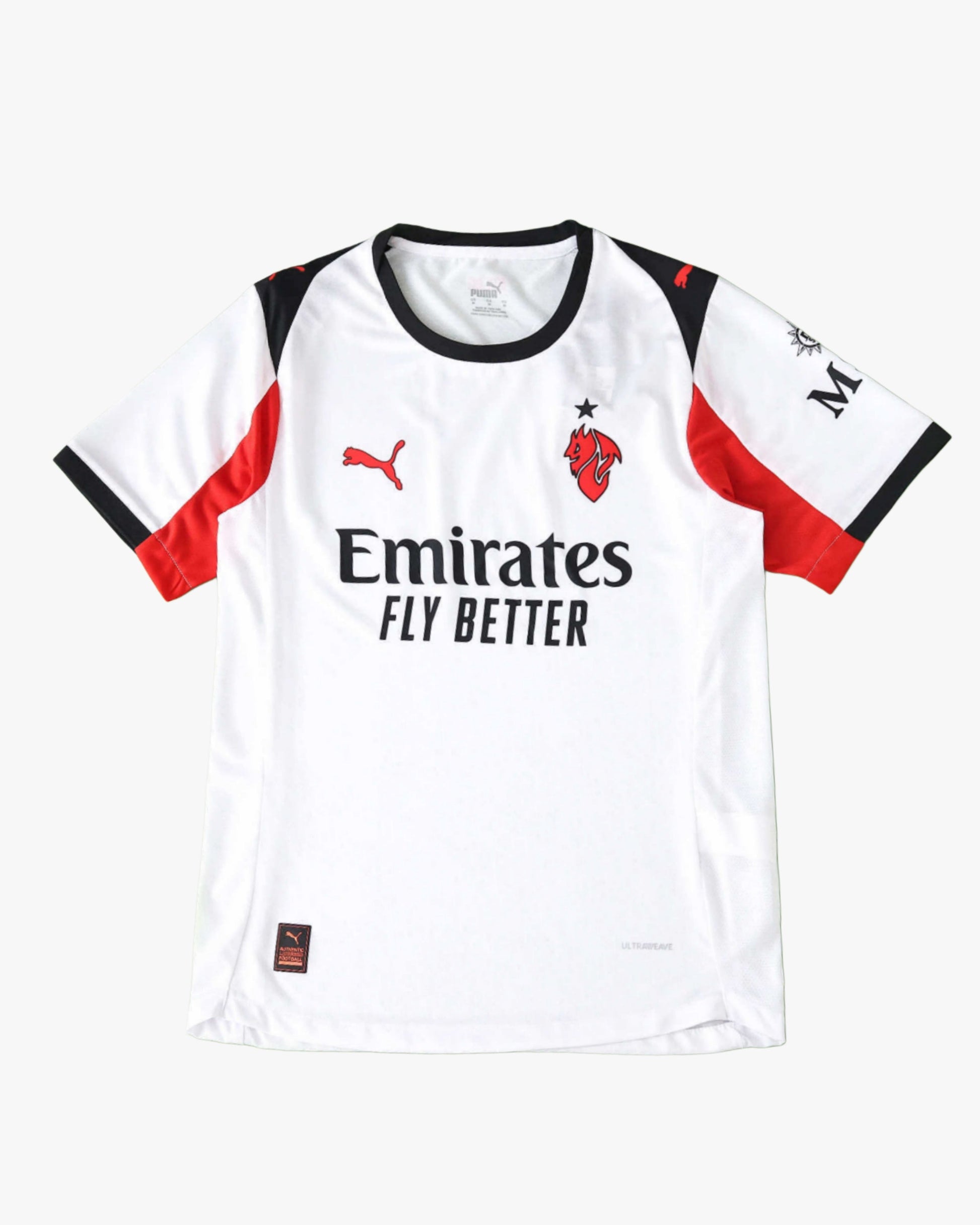 AC Milan 2025/26 away jersey in white with red and black accents and sponsor logos.