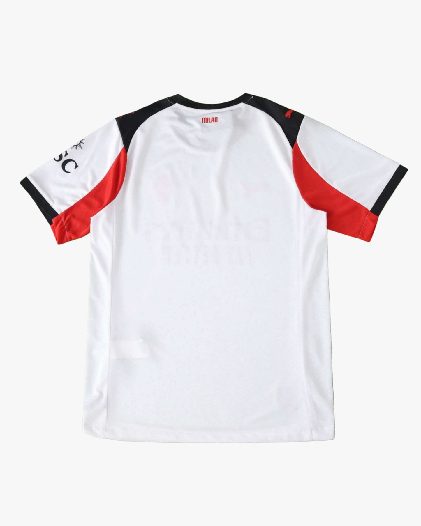 The back of a white AC Milan 2025/26 away jersey with red and black accents on the sleeves.