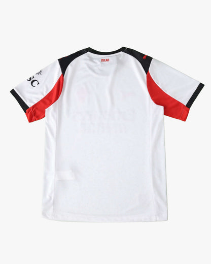 The back of a white AC Milan 2025/26 away jersey with red and black accents on the sleeves.