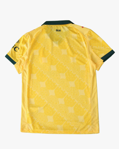 AC Milan 2025/26 third jersey in yellow with green collar and sleeve trim.