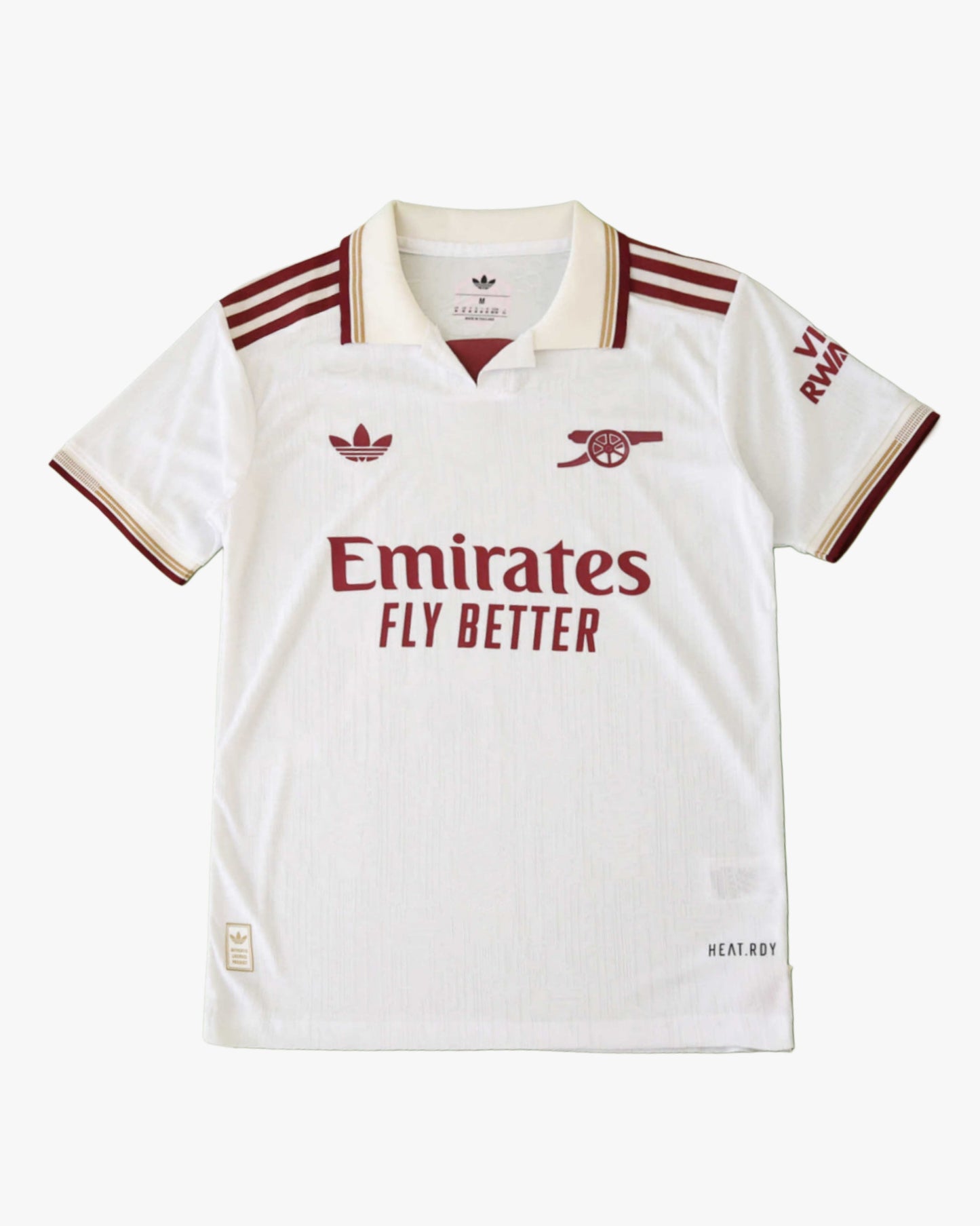 White Arsenal football jersey with maroon and gold accents.
