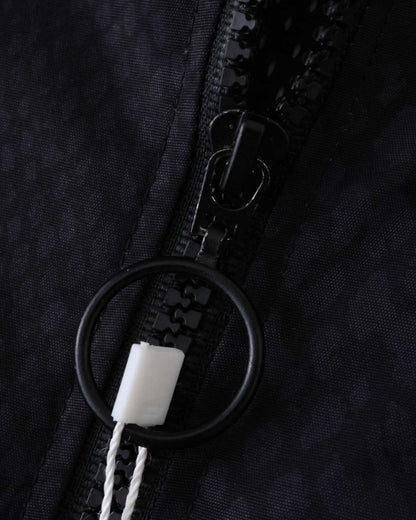 Black Footxo Barcelona windbreaker with a black zipper and ring pull.