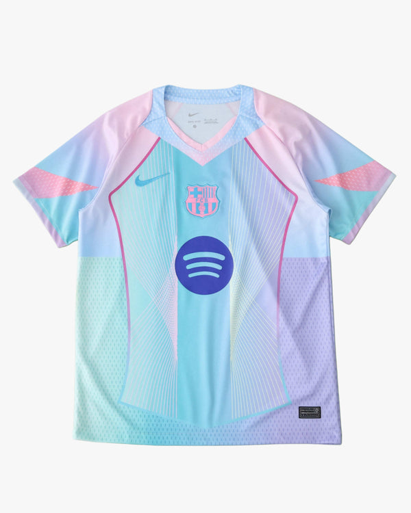 A pastel gradient football jersey with the FC Barcelona crest and Spotify logo.
