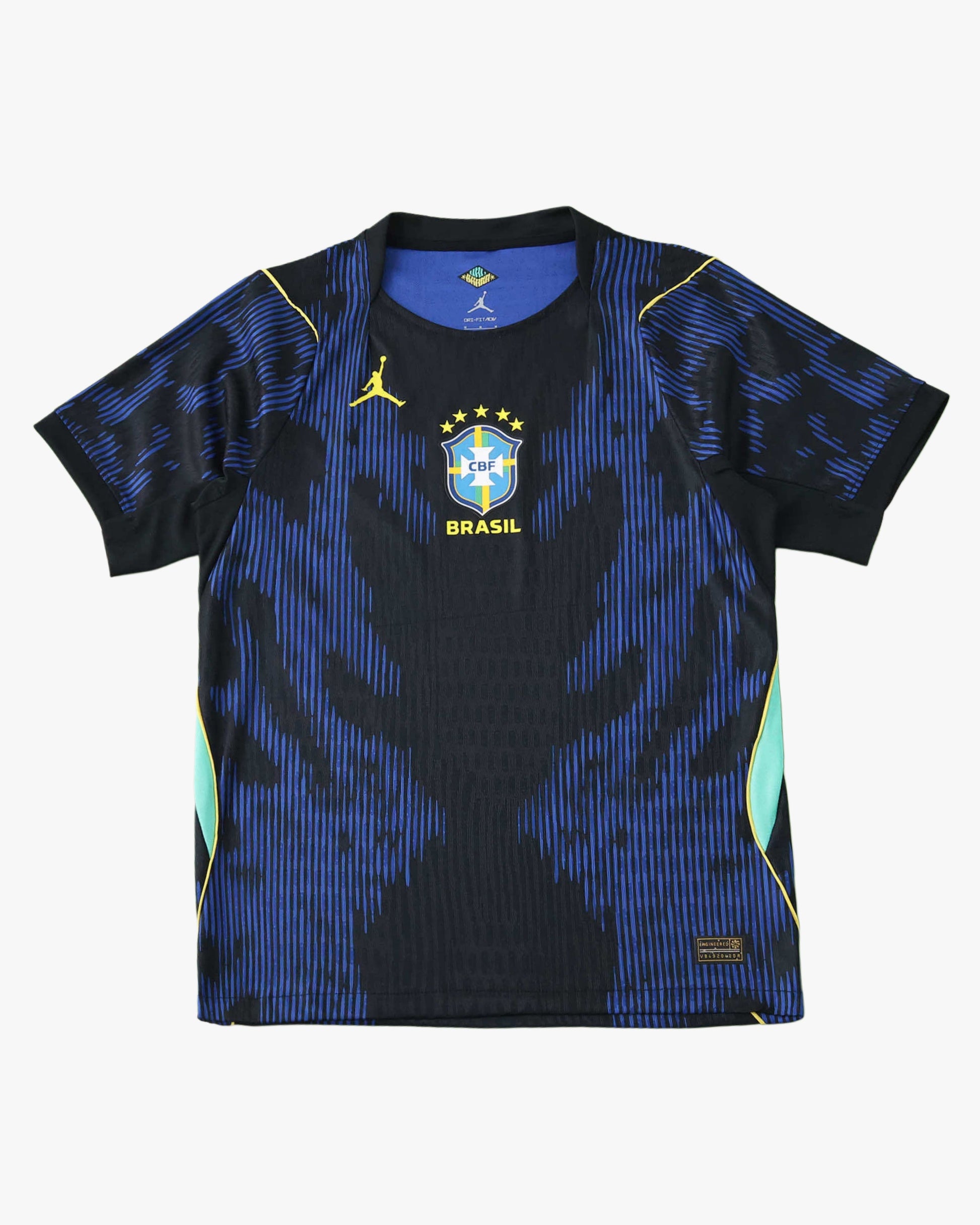 Blue and black Brazil Away football jersey 2026 World Cup with tonal jagged print, yellow Jumpman and CBF crest