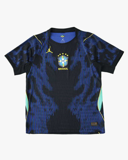 Blue and black Brazil Away football jersey 2026 World Cup with tonal jagged print, yellow Jumpman and CBF crest