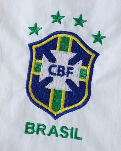 Embroidered Brazil crest and stars on a white jacket.