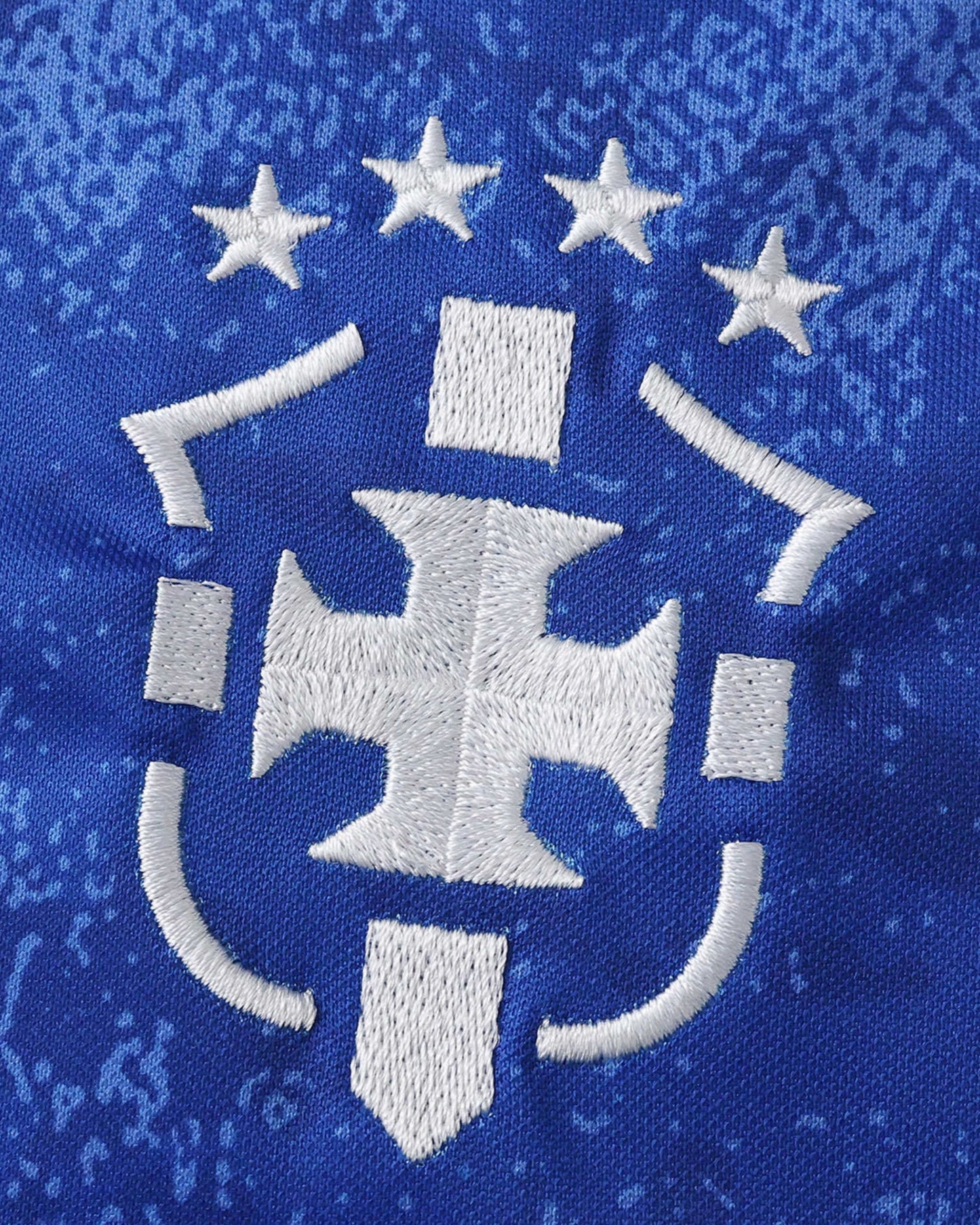 Brazil Commemorative football jersey sleeve detail with white symbol graphics on royal blue