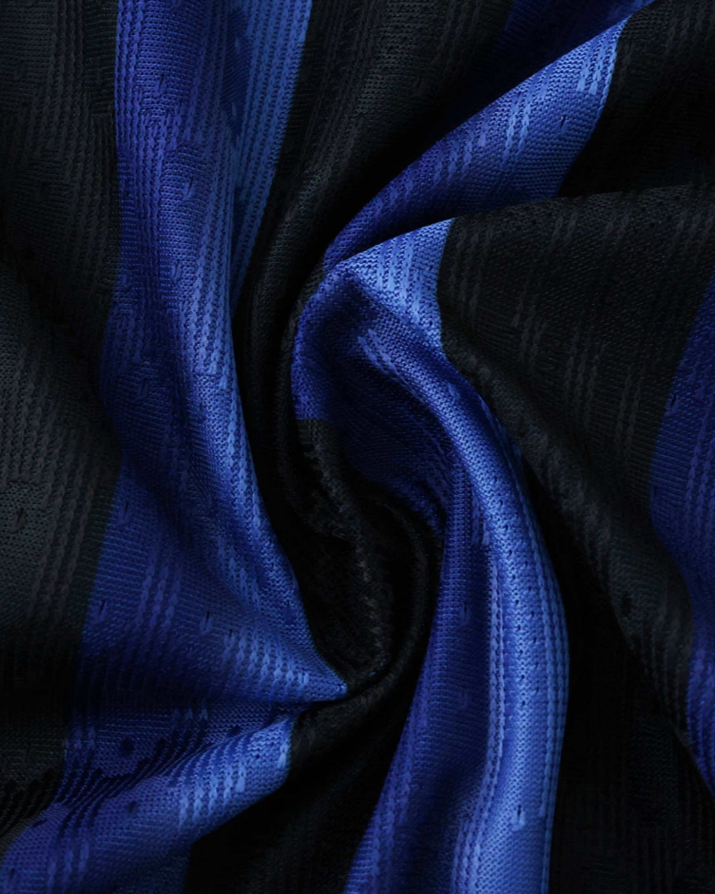 A close-up of a blue and black striped Inter Milan jersey with a textured fabric.