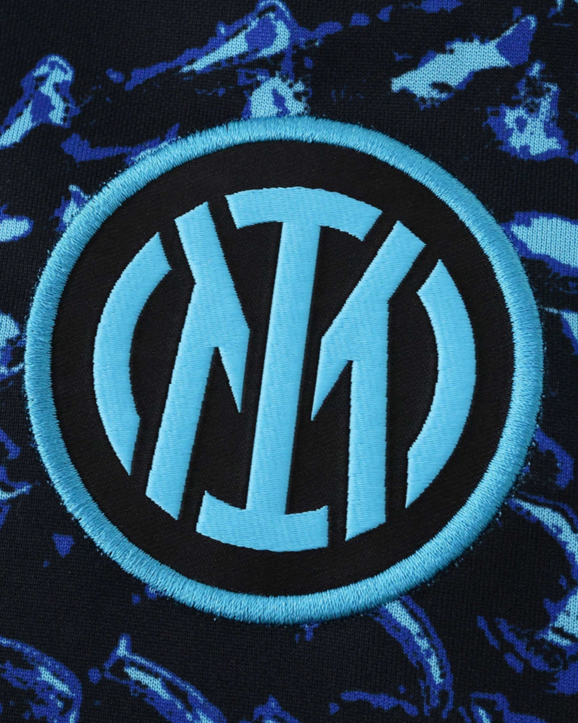 Inter Milan pre-match jersey with a blue and black abstract pattern and the club crest.