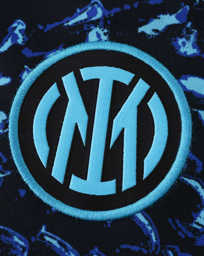 Inter Milan pre-match jersey with a blue and black abstract pattern and the club crest.