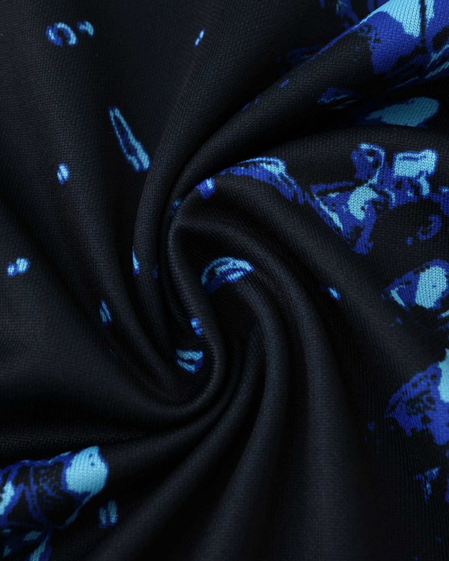 Black and blue patterned Inter Milan training shirt fabric.