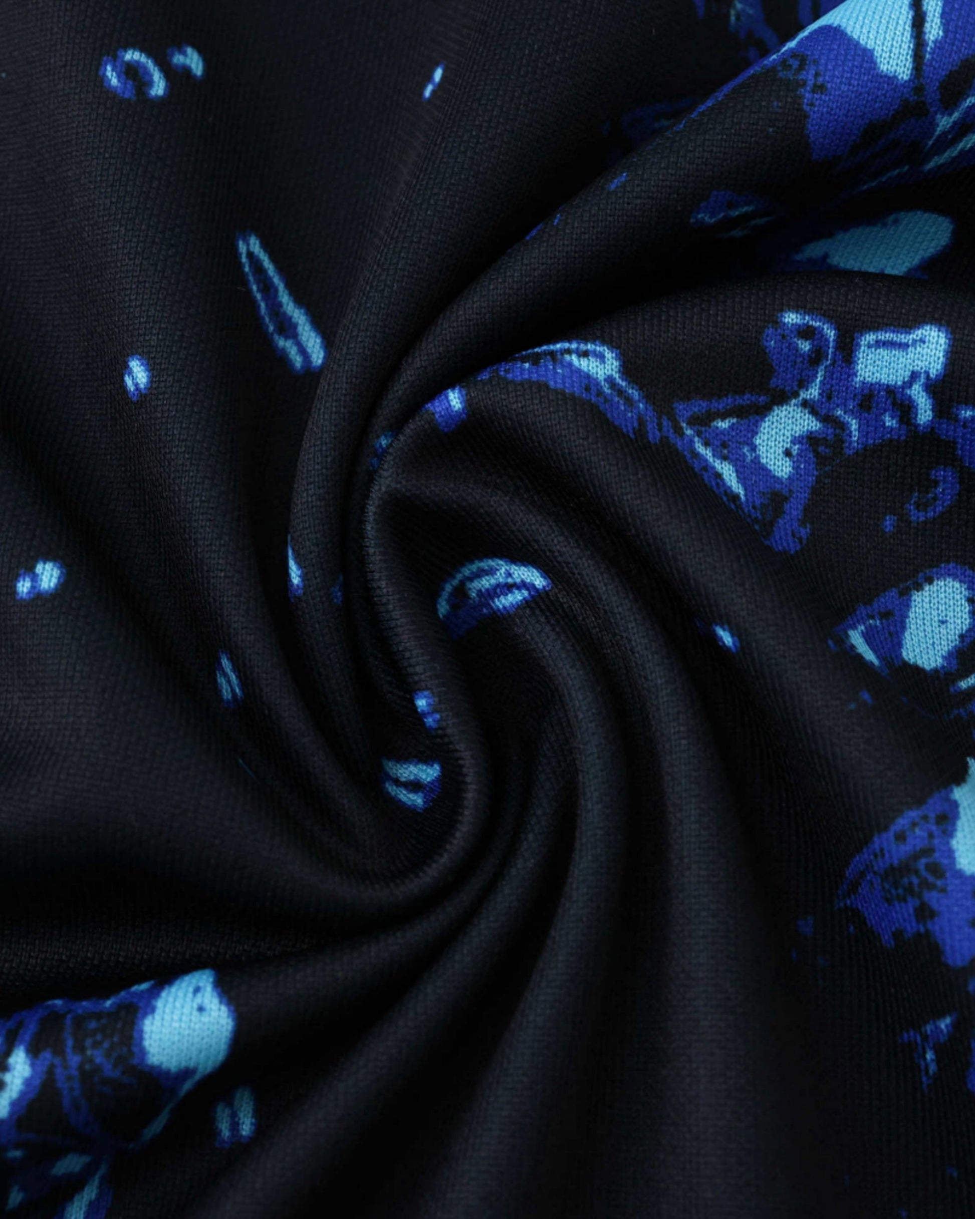Black and blue patterned Inter Milan training shirt fabric.
