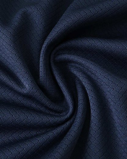 Dark blue textured fabric with a subtle diamond pattern.