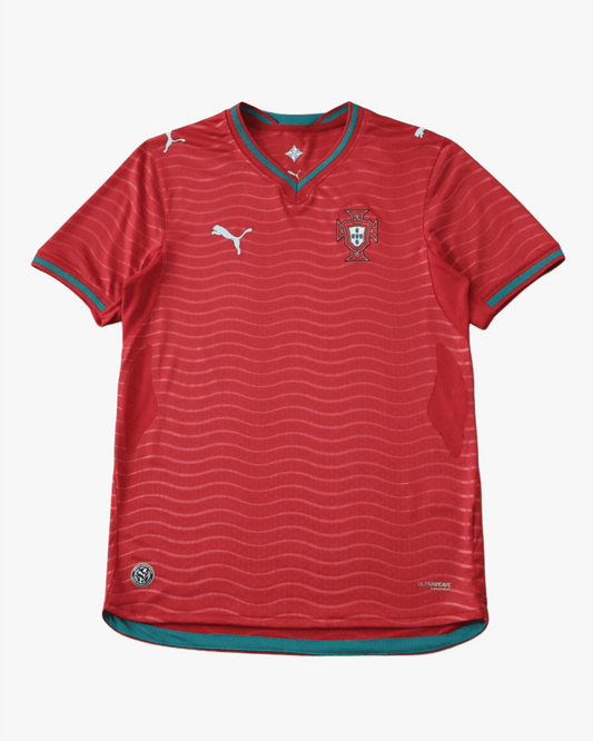 Red Portugal soccer jersey with wavy pattern and teal trim.