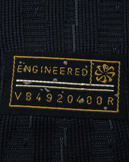 Black Nike jersey tag with "ENGINEERED" and code V84920400R.
