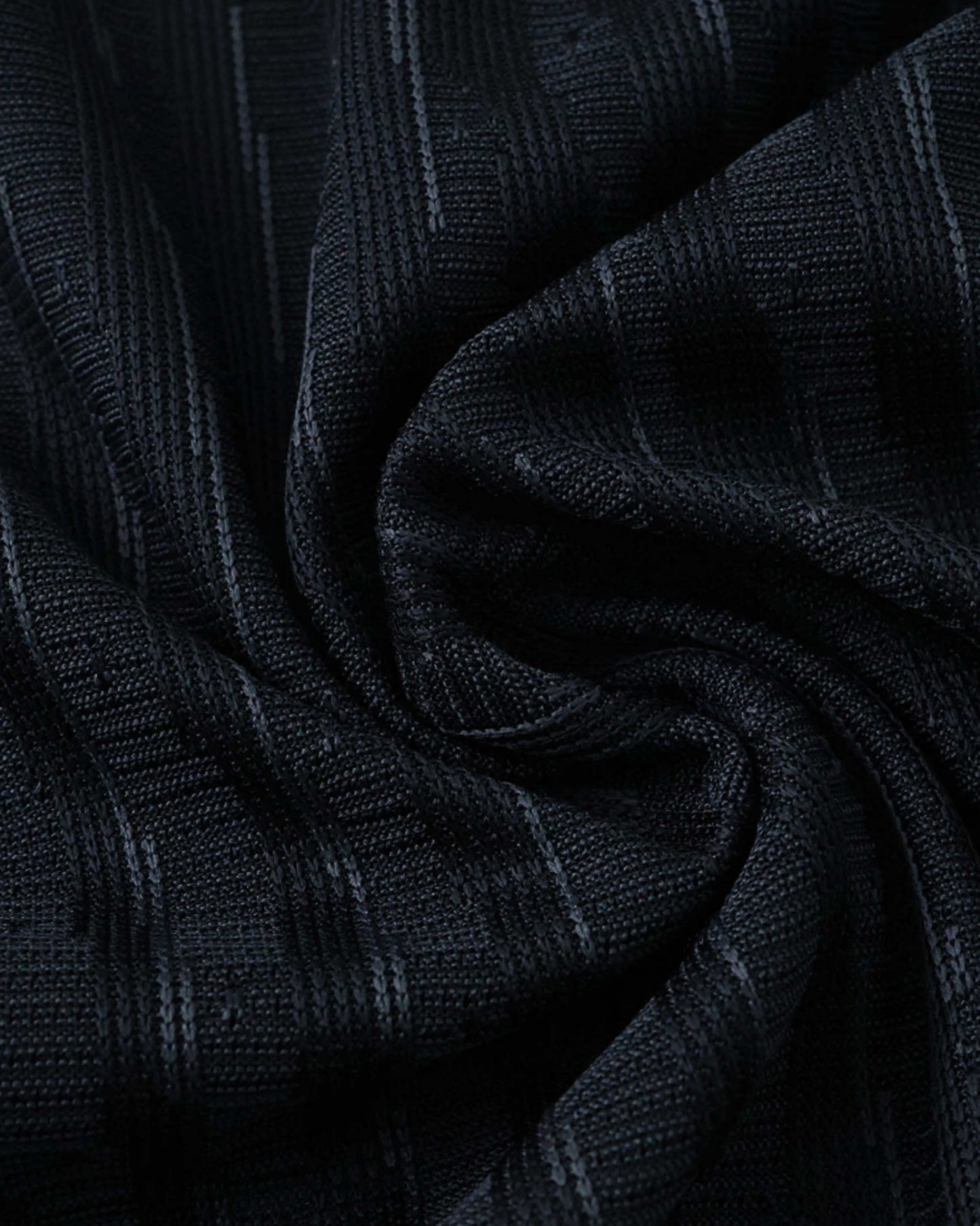 Black fabric with a subtle vertical stripe pattern.