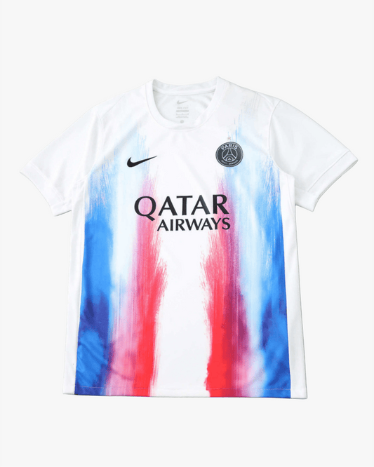 White Paris Saint-Germain pre-match training jersey with colorful brushstroke design.