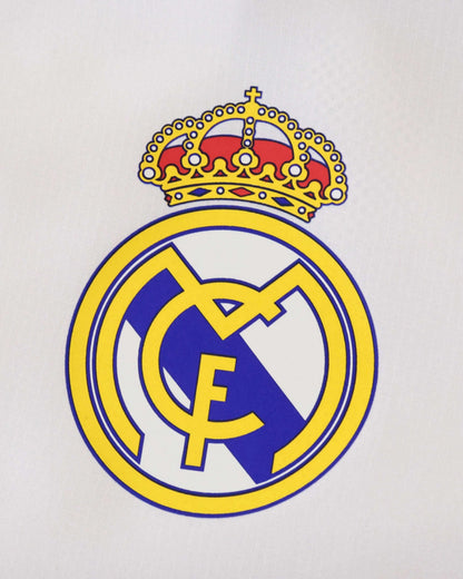 Real Madrid logo with crown on a white background.