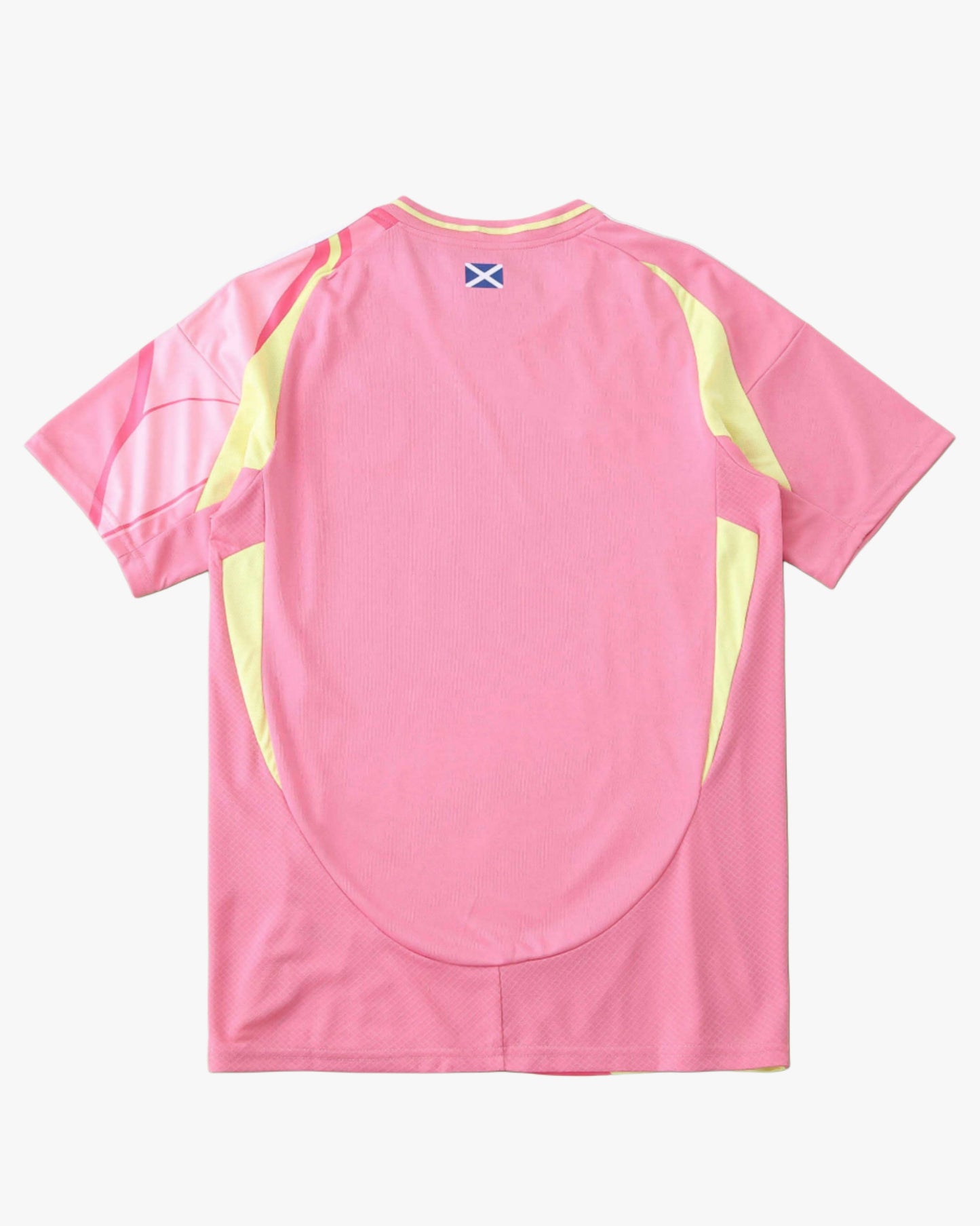 Pink Footxo Scotland away football shirt with yellow accents and a blue cross emblem.